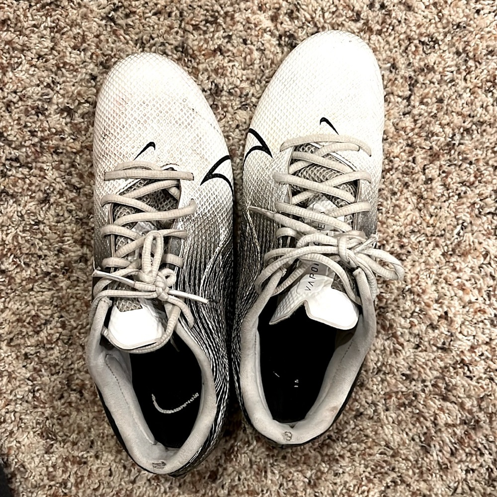 Nike vapor white cleats. Used but still good too small for me football cleats
